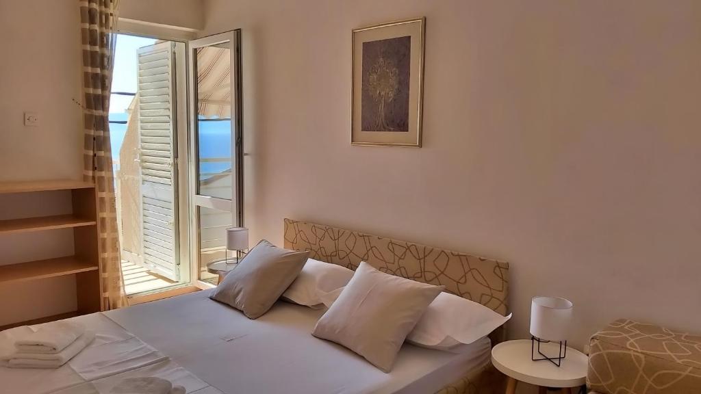 Postel nebo postele na pokoji v ubytování Apartment Juta
