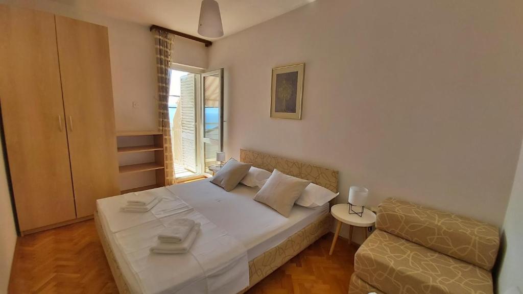 Postel nebo postele na pokoji v ubytování Apartment Juta