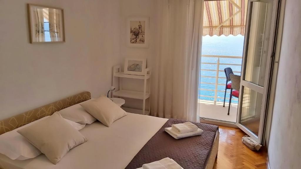 Postel nebo postele na pokoji v ubytování Apartment Juta
