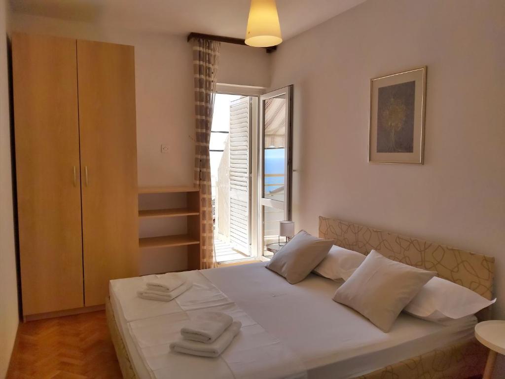 Postel nebo postele na pokoji v ubytování Apartment Juta