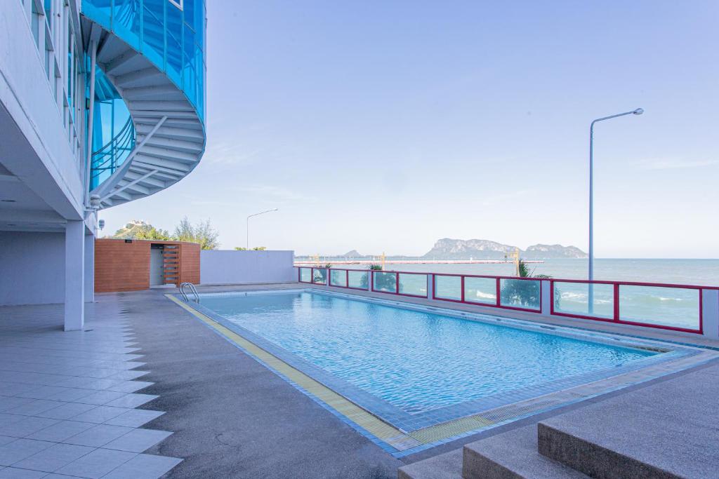 a swimming pool on the roof of a building at Hadthong Hotel in Prachuap Khiri Khan