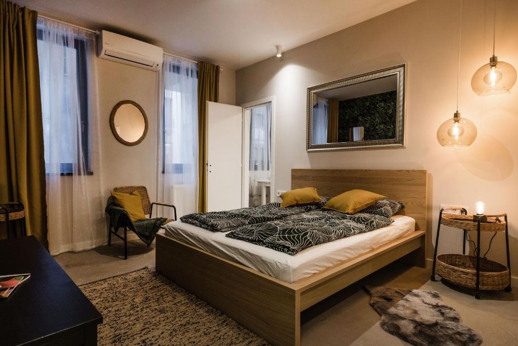 Posteľ alebo postele v izbe v ubytovaní Krane Apartments Ó utca