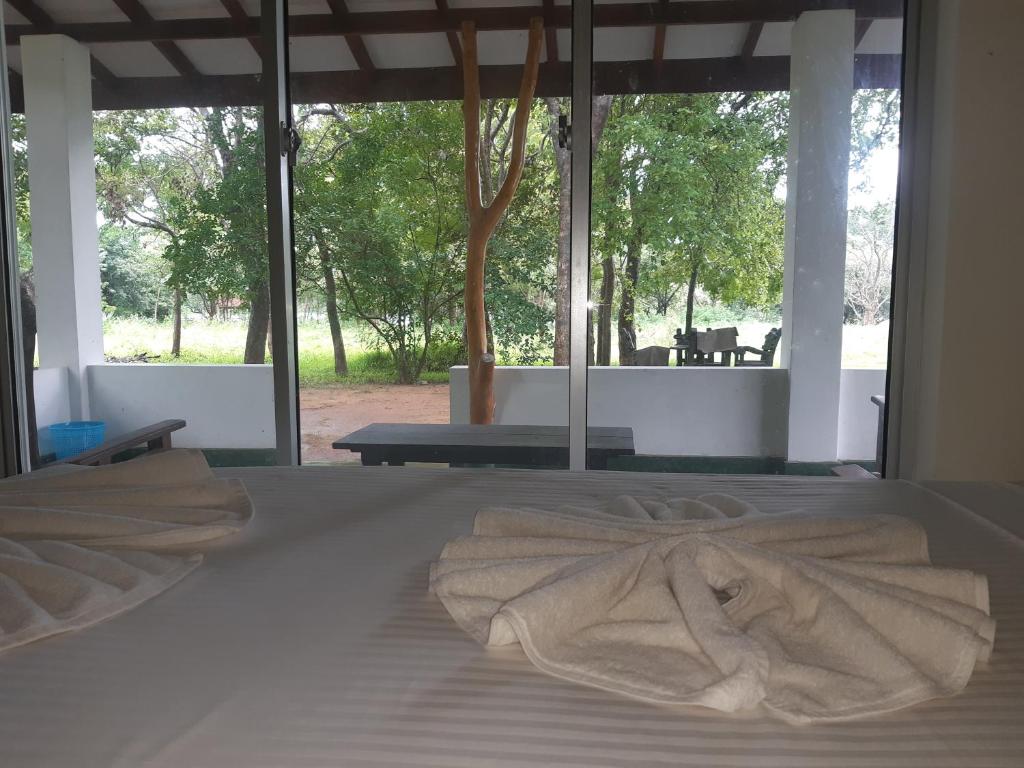 Postel nebo postele na pokoji v ubytování Banana Rest Sigiriya