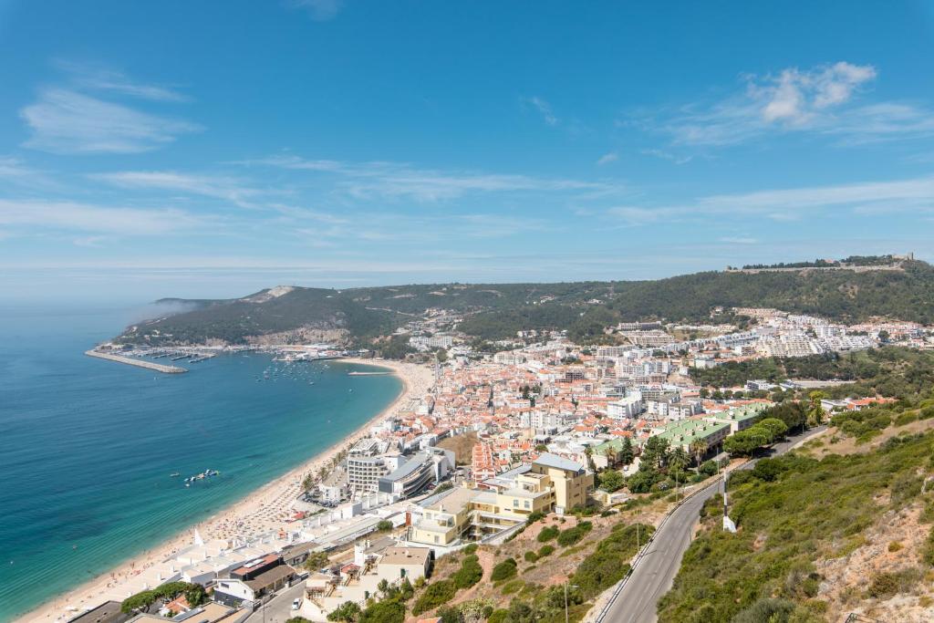 a view of positano on the amalfi coast at Turquoise Turtle Apartment - with seaview and A/C in Sesimbra