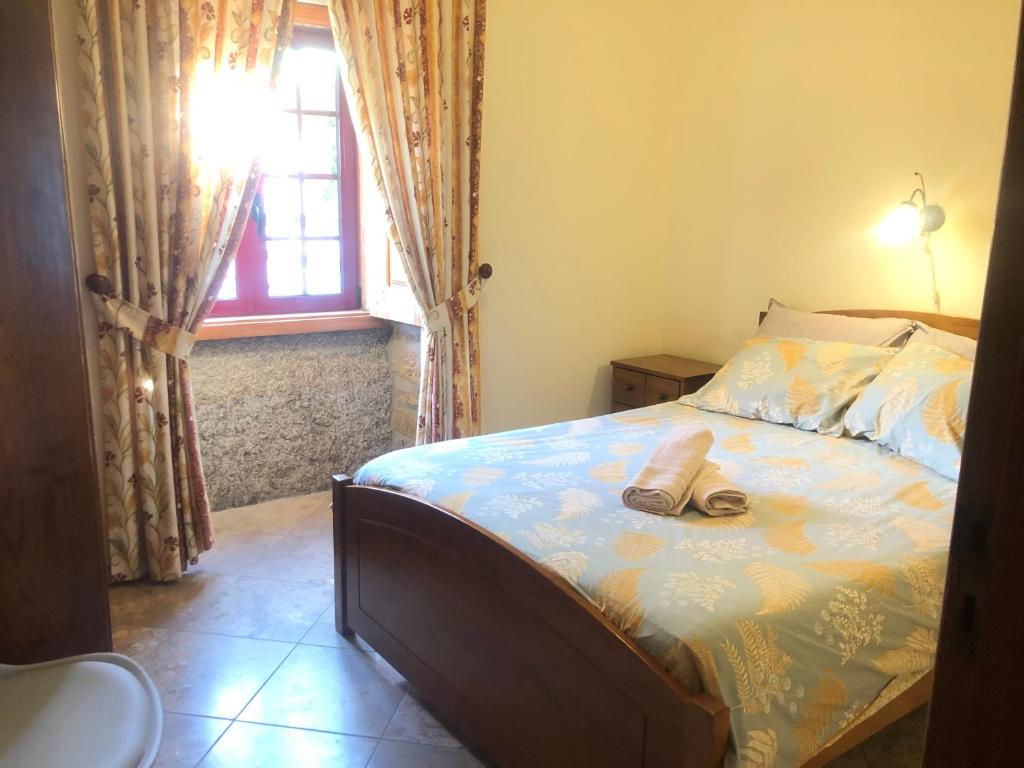 Uma cama ou camas num quarto em Quinta das Cegonhas