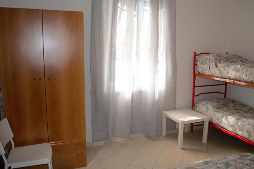 Łóżko lub łóżka w pokoju w obiekcie Appartamento 1m