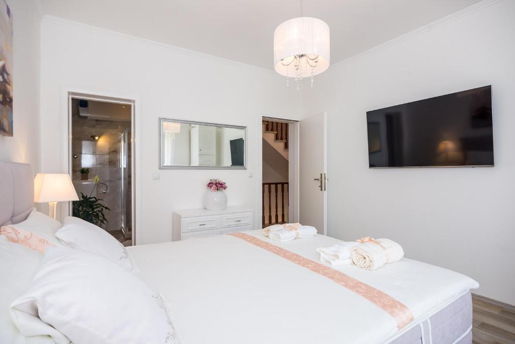 Posteľ alebo postele v izbe v ubytovaní Apartment & Rooms Duja