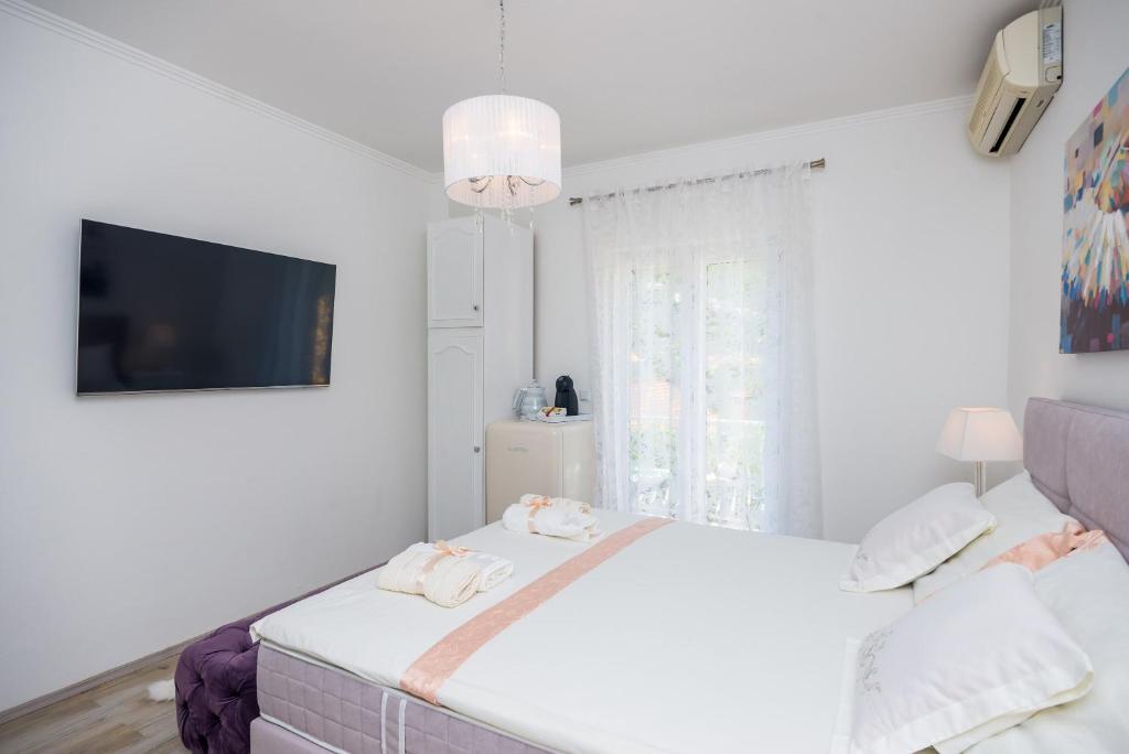 Posteľ alebo postele v izbe v ubytovaní Apartment & Rooms Duja
