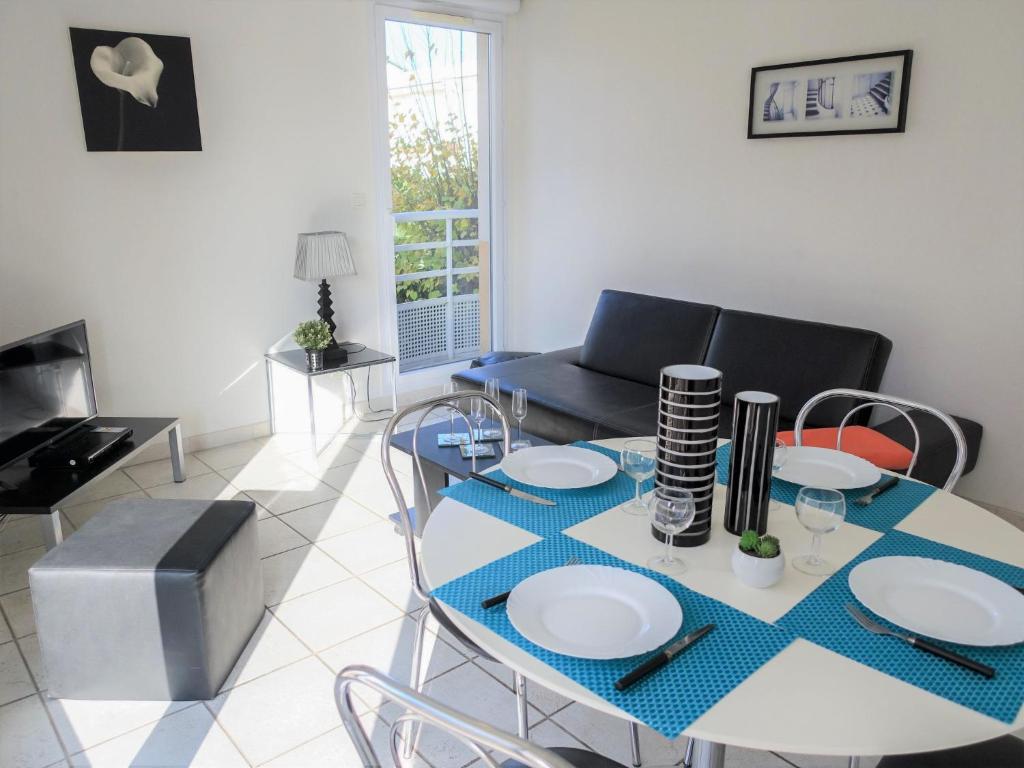 a living room with a table and chairs at Apartment Felicita by Interhome in Cros-de-Cagnes