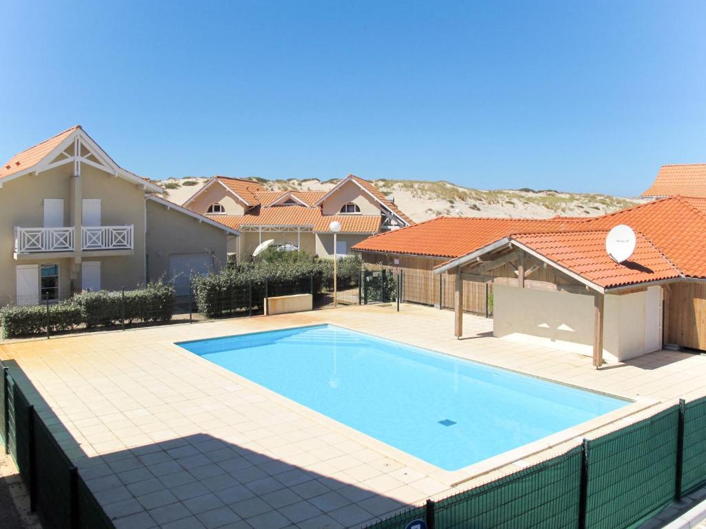 an image of a swimming pool in a house at Holiday Home Résidence Dune Blanche - Sable - BPL322 by Interhome in Biscarrosse-Plage