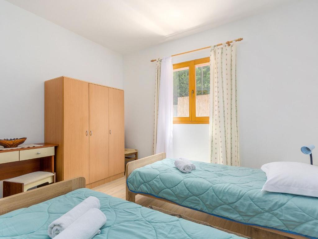 Postel nebo postele na pokoji v ubytování Holiday Home Villa Laura by Interhome