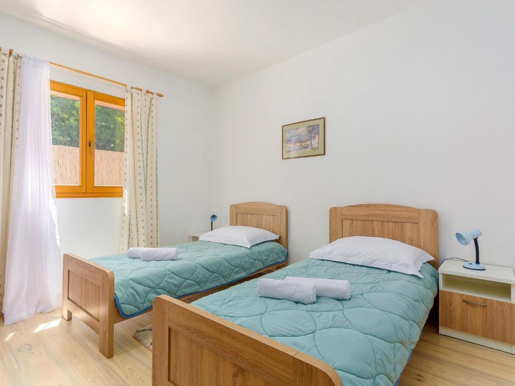 Postel nebo postele na pokoji v ubytování Holiday Home Villa Laura by Interhome