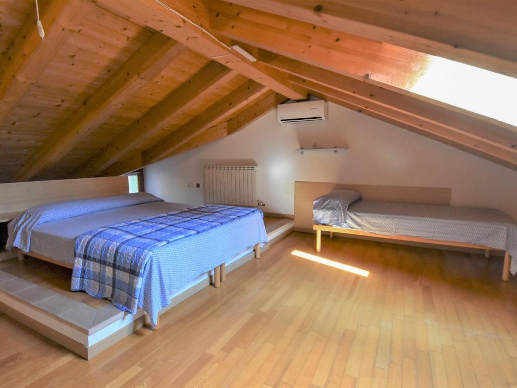 A bed or beds in a room at Apartment Solmare-7 by Interhome