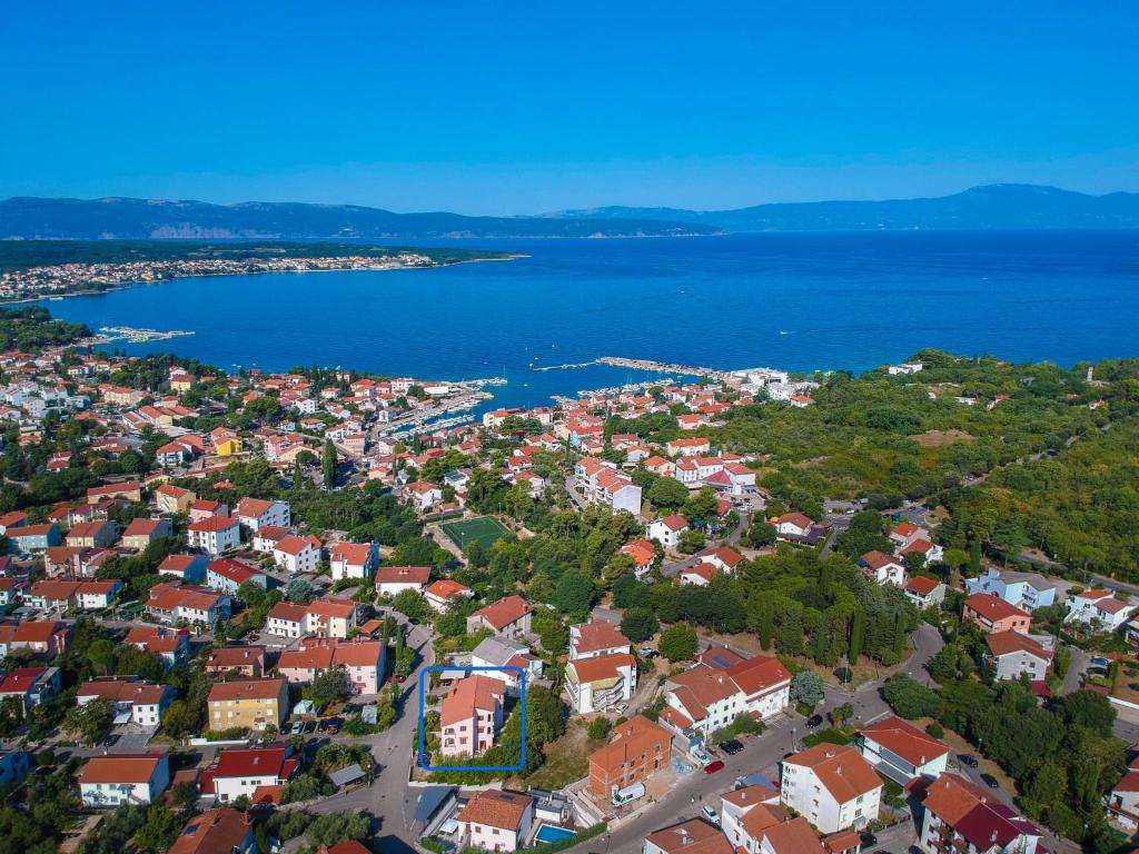 an aerial view of a town next to the water at Apartment Vera - MLK326 by Interhome in Malinska