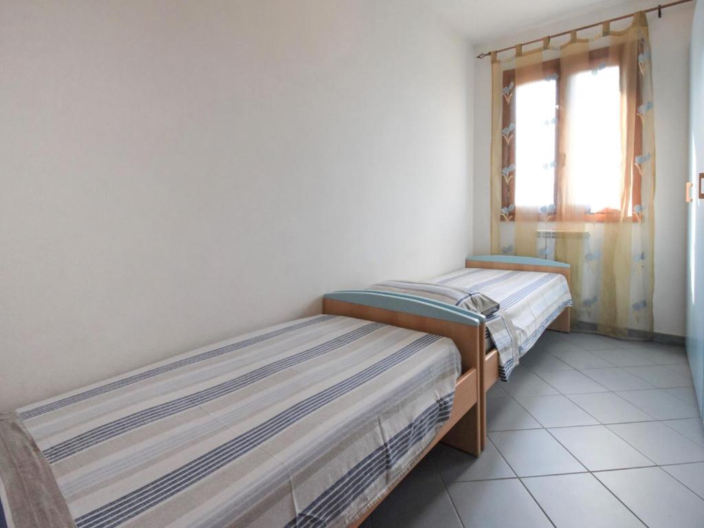 Postel nebo postele na pokoji v ubytování Apartment Solmare-6 by Interhome