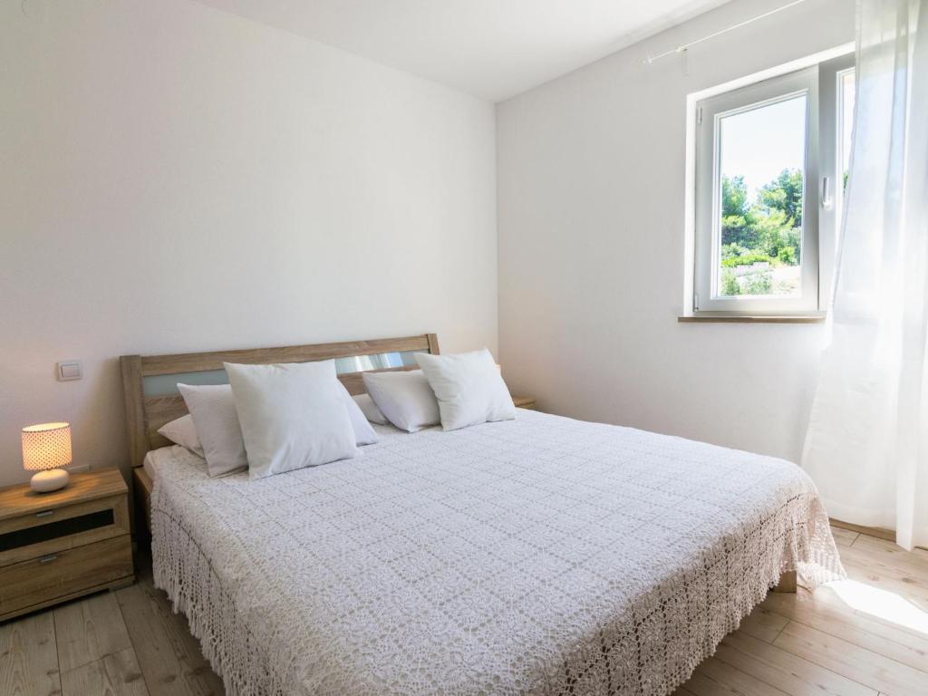Postel nebo postele na pokoji v ubytování Apartment Villa 2 Pools-3 by Interhome
