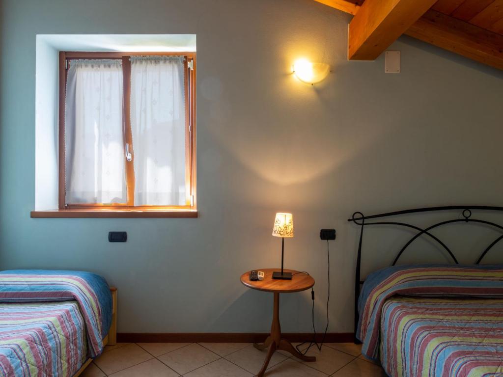 Postel nebo postele na pokoji v ubytování Holiday Home Elisa by Interhome