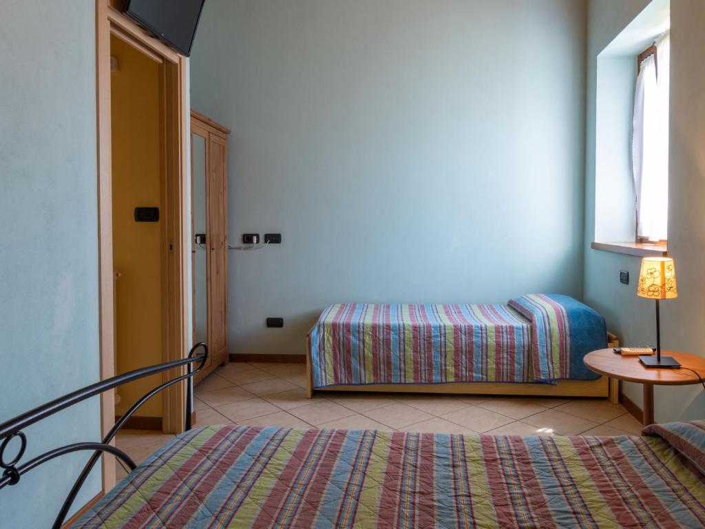 Postel nebo postele na pokoji v ubytování Holiday Home Elisa by Interhome