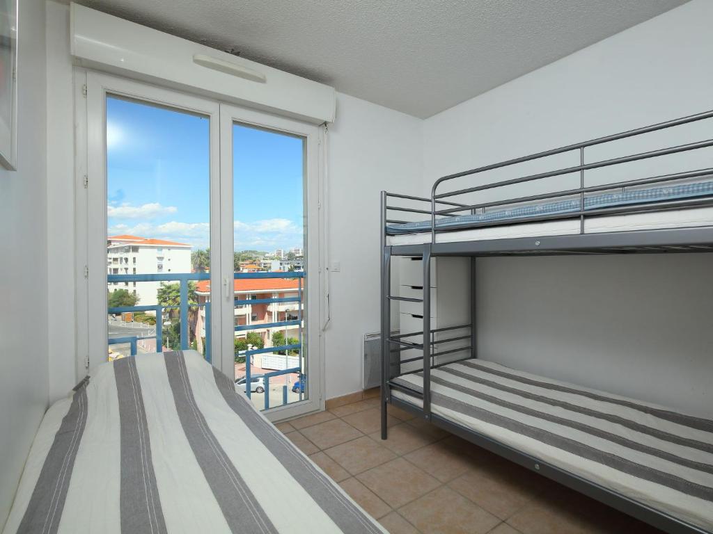 Postel nebo postele na pokoji v ubytování Apartment Le Grand Large by Interhome