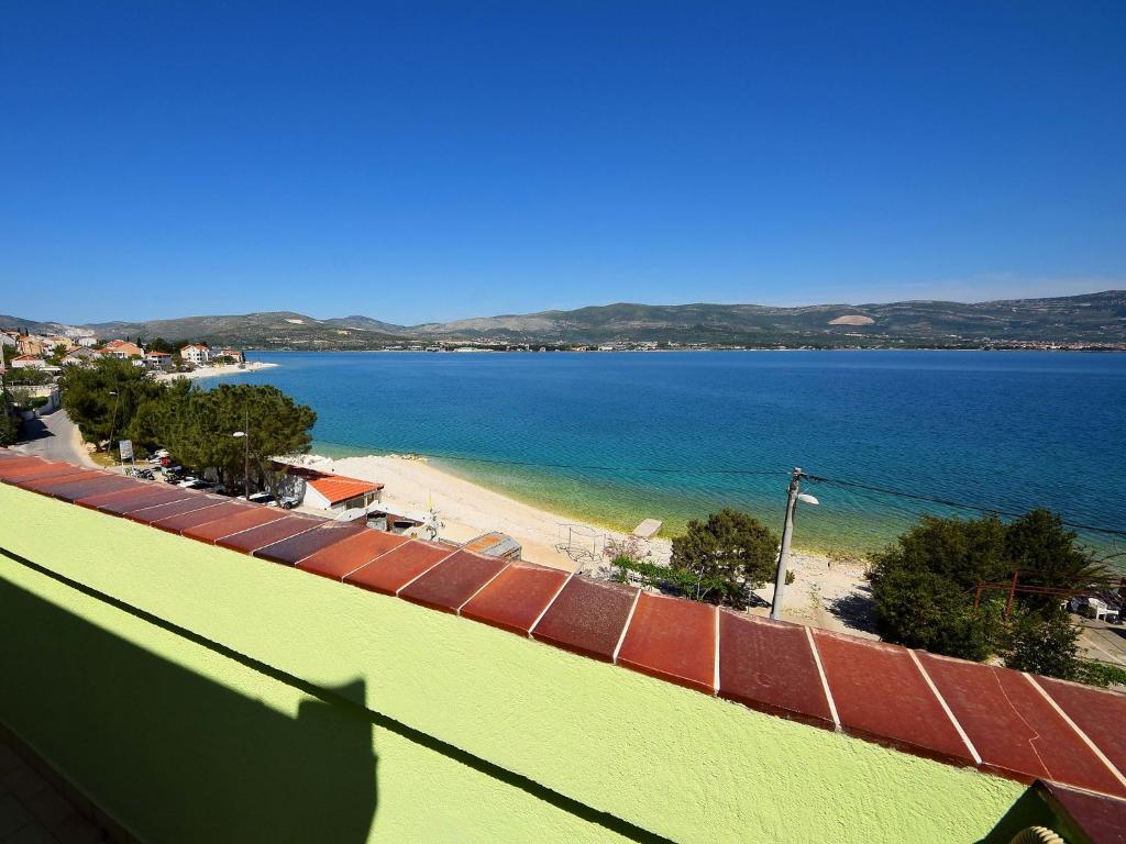 a view of a beach and the ocean from a building at Apartment Šarić-1 by Interhome in Trogir