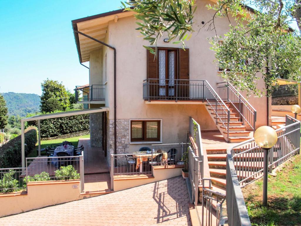 a villa with a staircase leading up to a house at Apartment Cristina-1 by Interhome in Santa Lucia