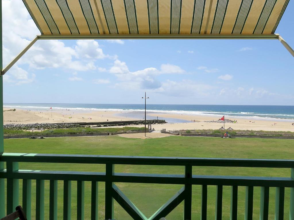a view of a beach from a balcony at Apartment Cap Océan by Interhome in Mimizan-Plage