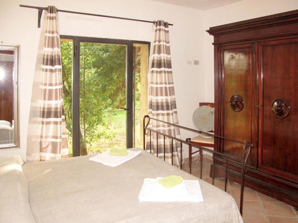 Posteľ alebo postele v izbe v ubytovaní Apartment Le Sodole - Papavero by Interhome