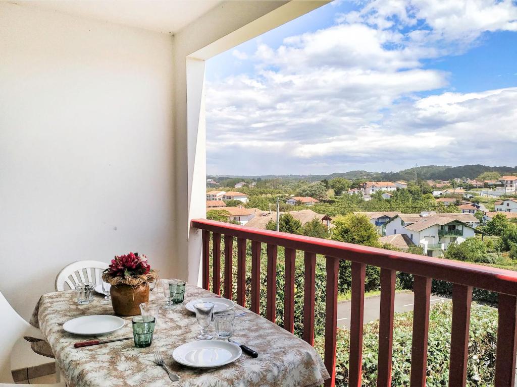 a table on a balcony with a view at Apartment Hego Alde by Interhome in Bidart