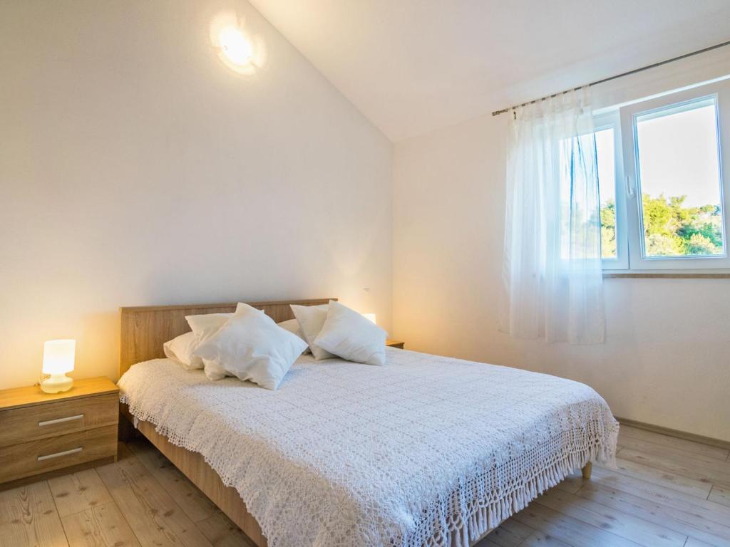 Postel nebo postele na pokoji v ubytování Apartment Villa 2 Pools-5 by Interhome