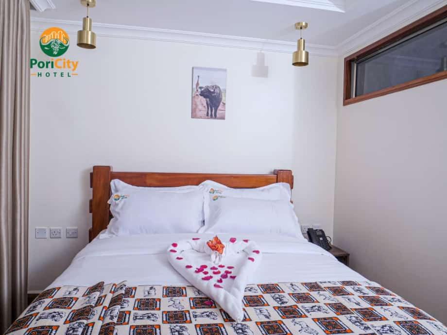 Postel nebo postele na pokoji v ubytování Pori City Hotel