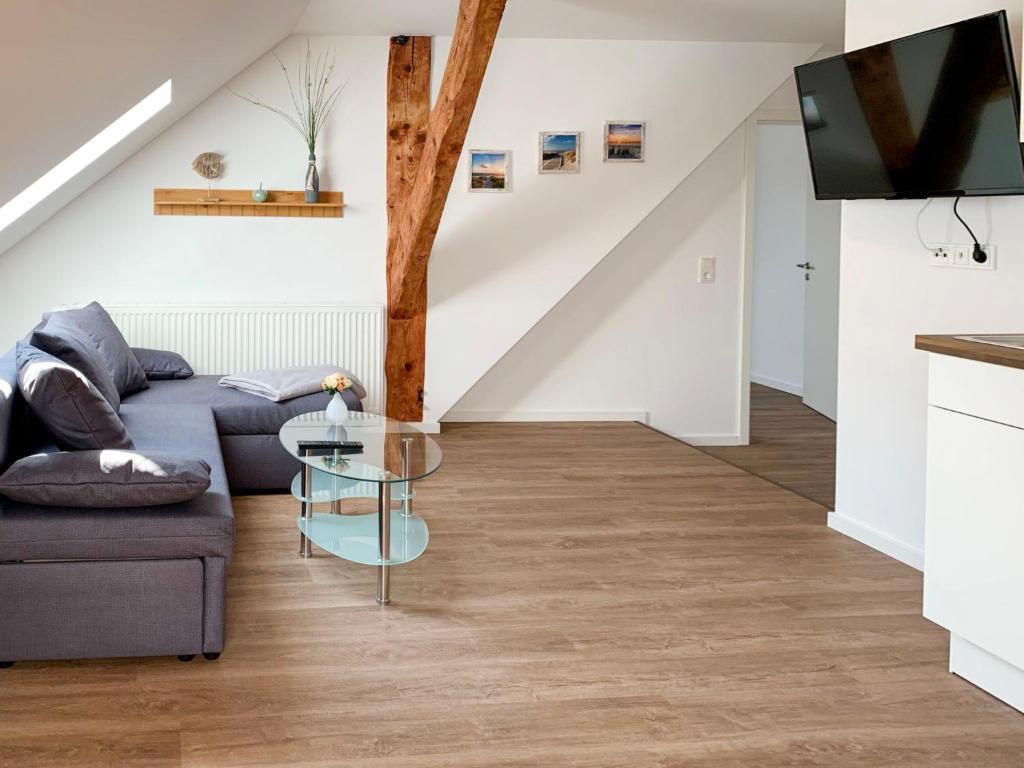 a living room with a couch and a table at Apartment Baltrum by Interhome in Westerholt