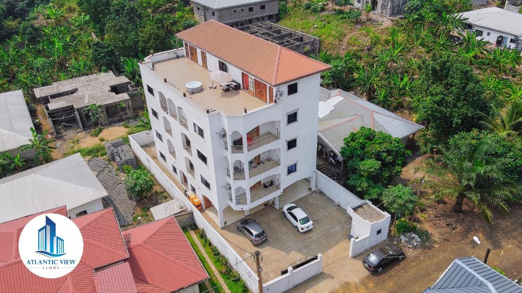 an overhead view of a white building with a red roof at Atlantic View Apartments in Limbe