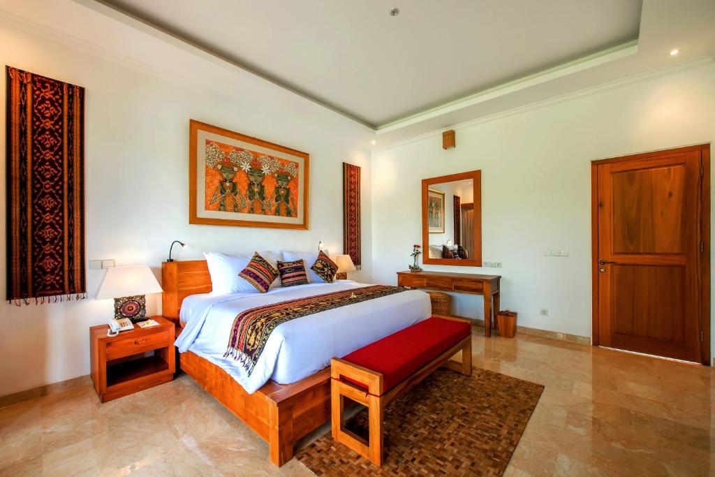 Postel nebo postele na pokoji v ubytování GK Bali Resort