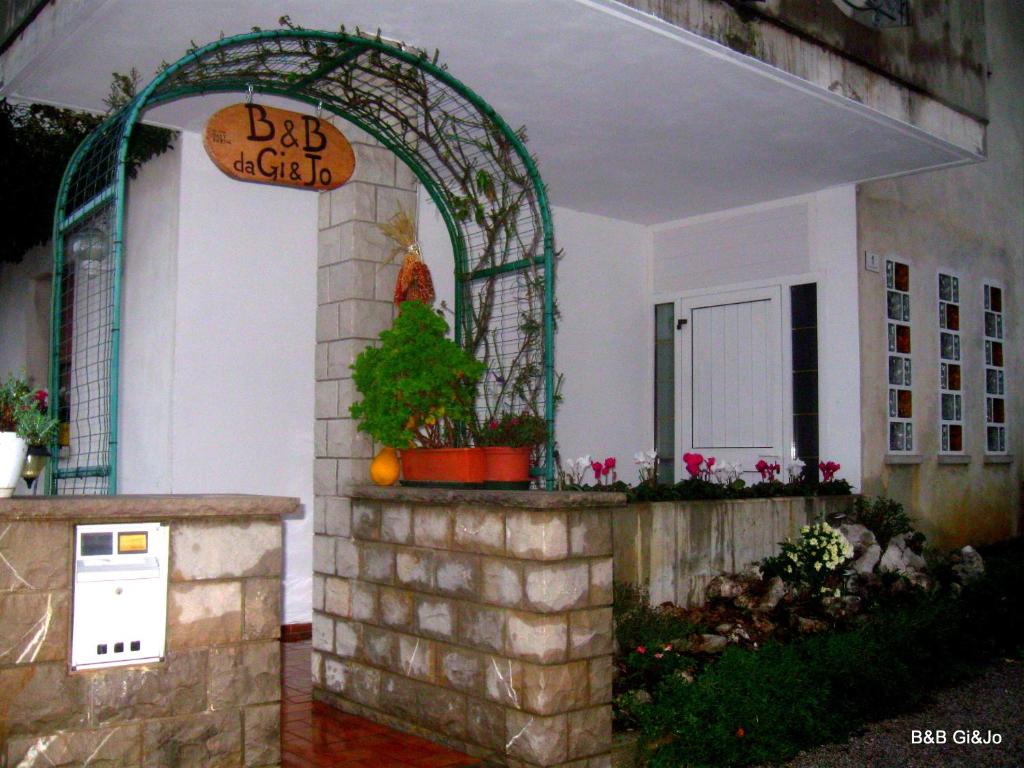 an entrance to a building with a christmas tree in it at B&B da Gi&Jo in Forgaria nel Friuli