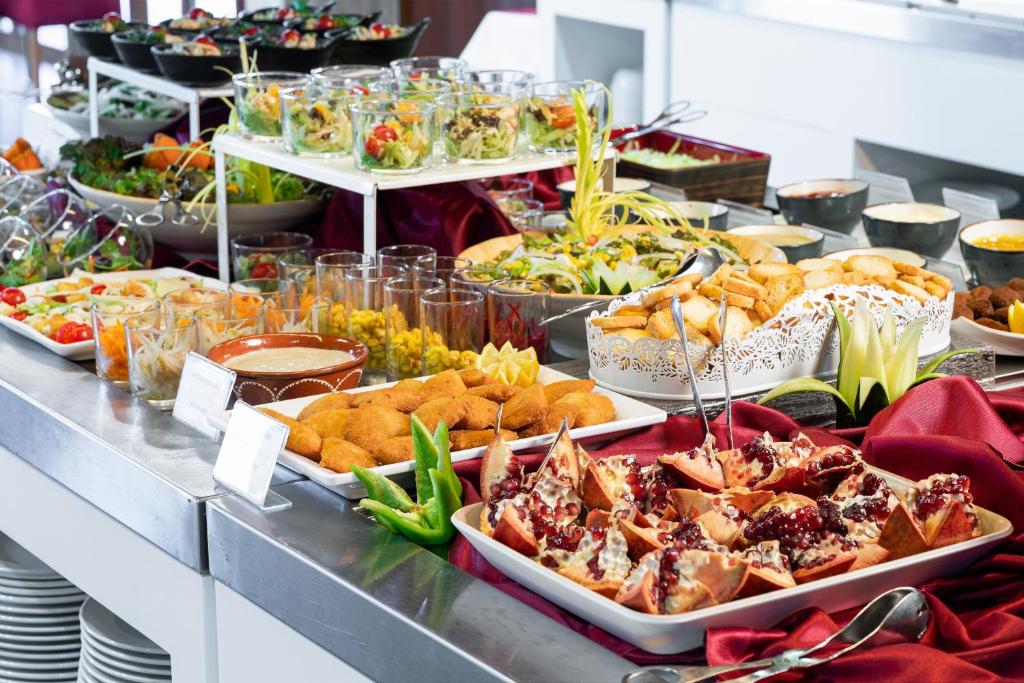 a buffet line with many different types of food at Interpass Vau Hotel Apartamentos in Portimão