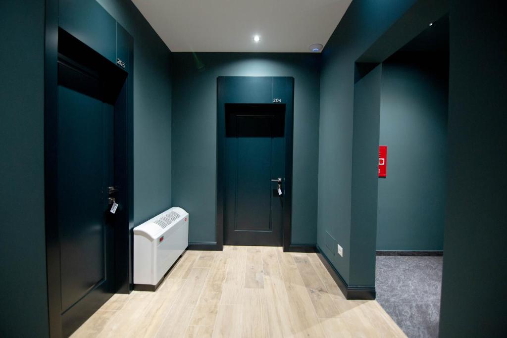 Postel nebo postele na pokoji v ubytování Mergan Hotel