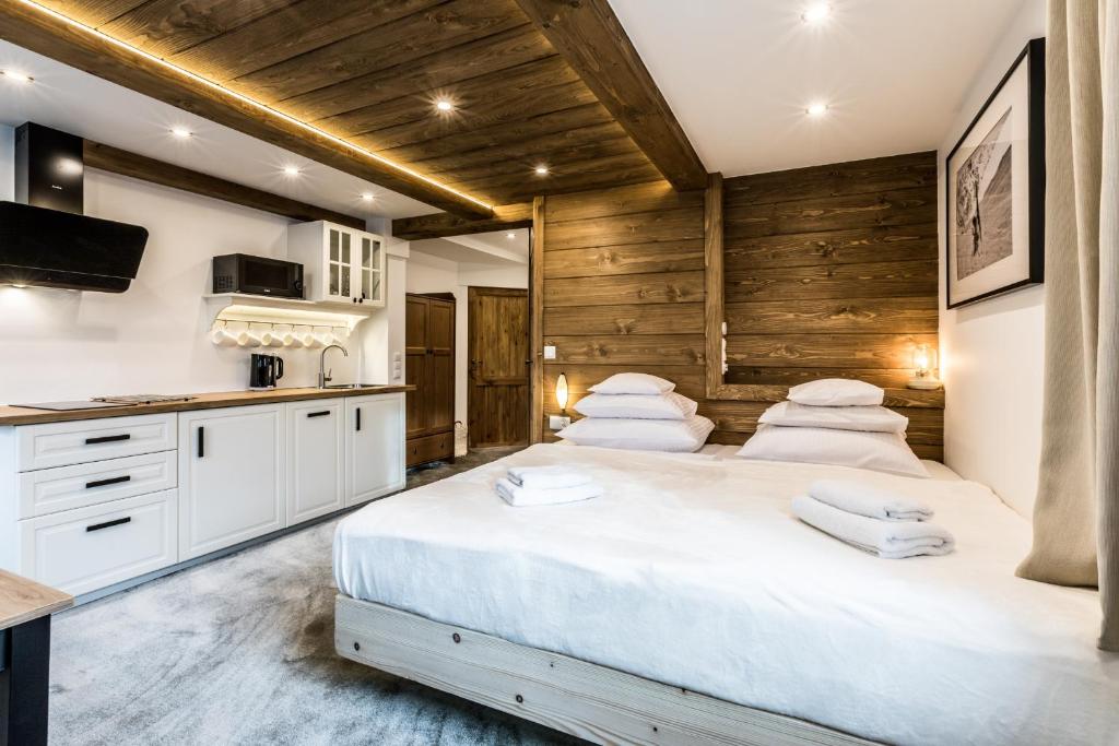 Posteľ alebo postele v izbe v ubytovaní Apartamenty Szymaszkowa