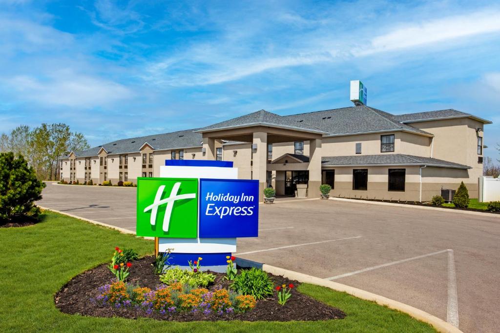 a sign in front of a building at Holiday Inn Express London-I-70, an IHG Hotel in London
