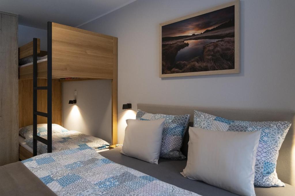Łóżko lub łóżka w pokoju w obiekcie APARTMÁNY PADESÁTKA - Polední Kameny