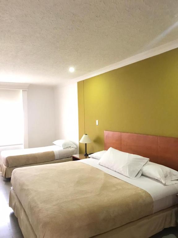 Postel nebo postele na pokoji v ubytování Vajamar Hotel