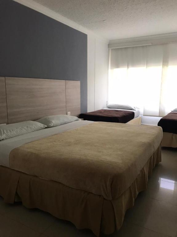 Postel nebo postele na pokoji v ubytování Vajamar Hotel