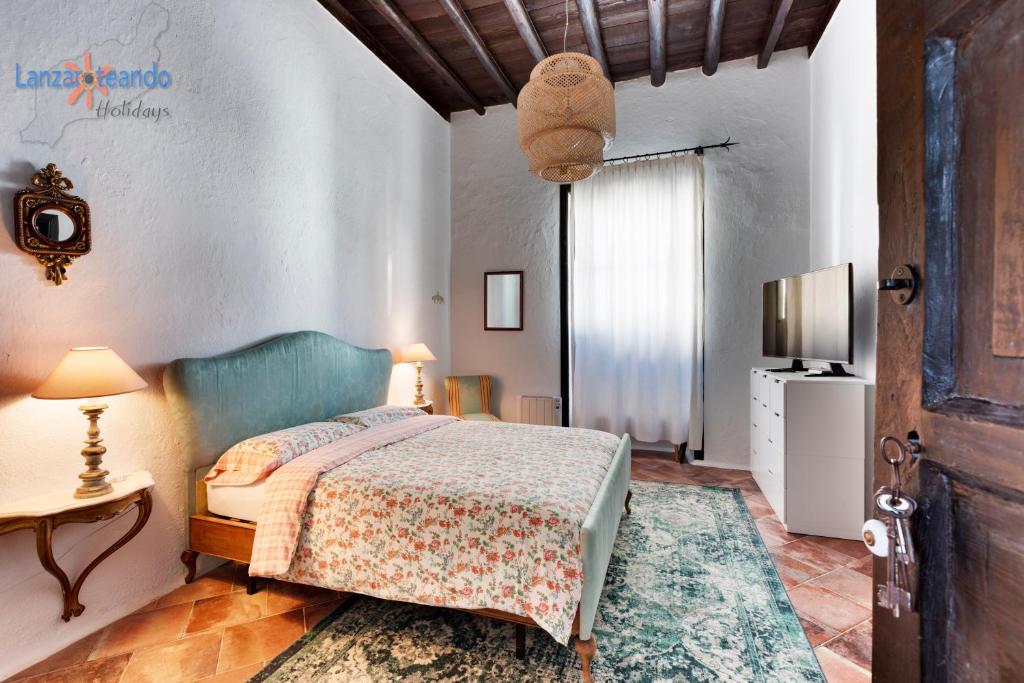 Postel nebo postele na pokoji v ubytování Vivienda Vacacional El Patio de Franky