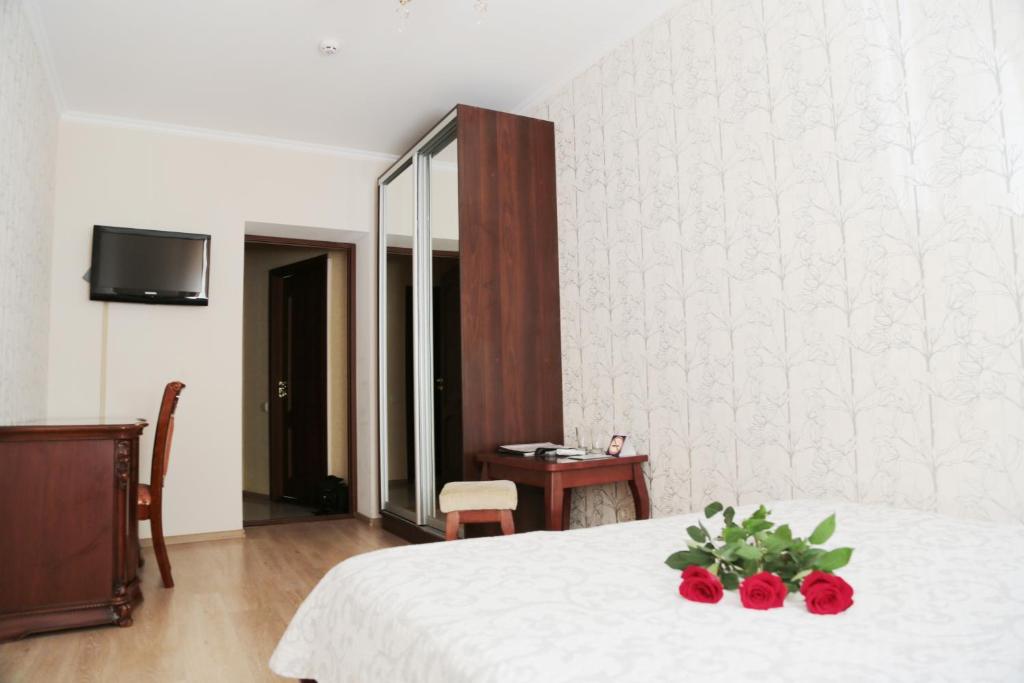 Postel nebo postele na pokoji v ubytování Evropeyskiy