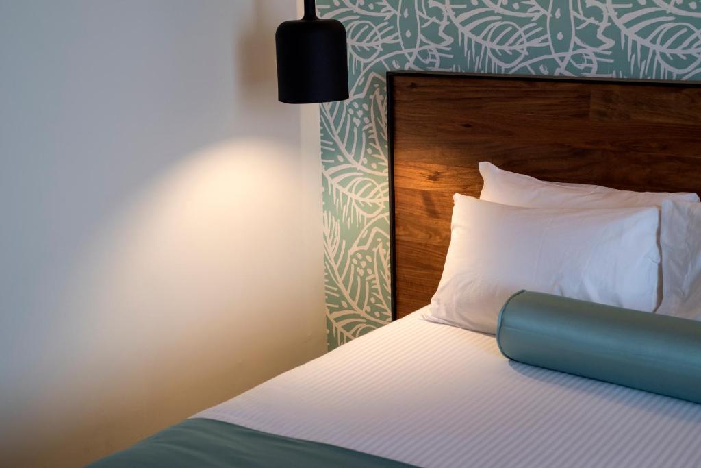 Postel nebo postele na pokoji v ubytování Hotel Y Parque Acuático La Caldera