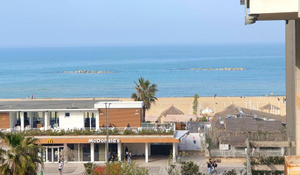 a view of a beach and the ocean at Regina Elena al mare in Pescara