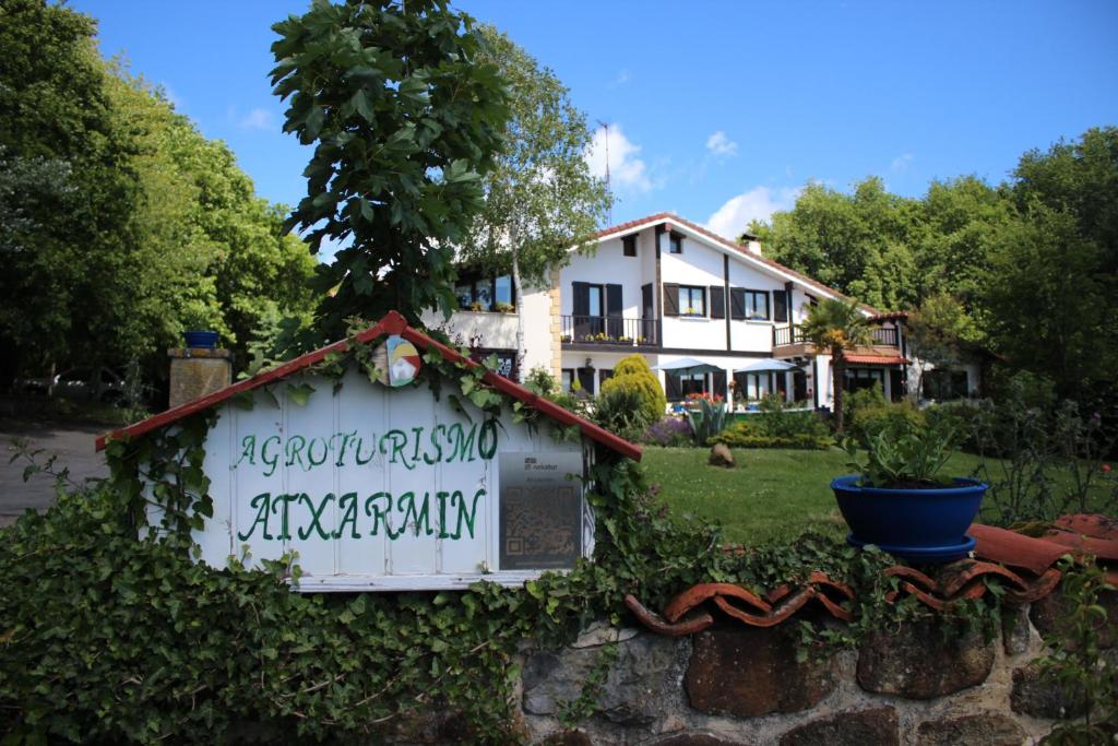 a sign in front of a house at Agroturismo Atxarmin in Elosu