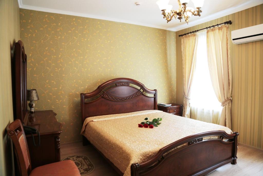 Postel nebo postele na pokoji v ubytování Evropeyskiy
