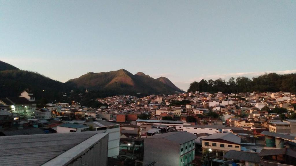 a view of a city with mountains in the background at Suite Bella Vista in Nova Friburgo