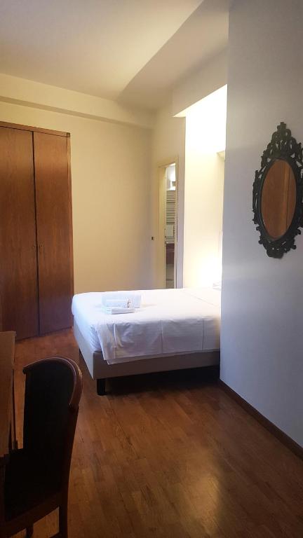 Posteľ alebo postele v izbe v ubytovaní Hotel Elefante