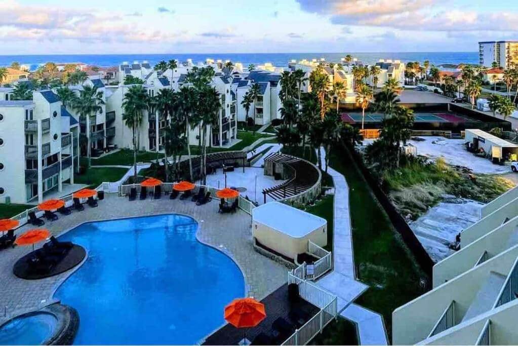 a view of a swimming pool with umbrellas at Bahia Mar Solare Tower 6th floor Bayview Condo 2bd 2ba with Pools and Hot tubs in South Padre Island